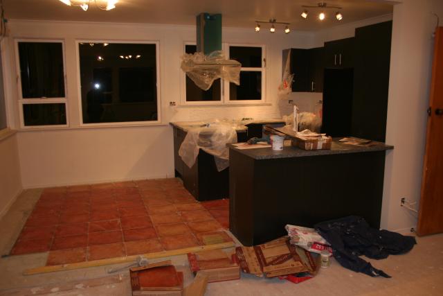 2012-06-12 Lights on, final cupboards, tiling started 2