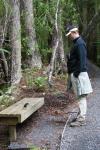 58 - Ulva Island - Jeff conversing with a robin (Toutouwai)